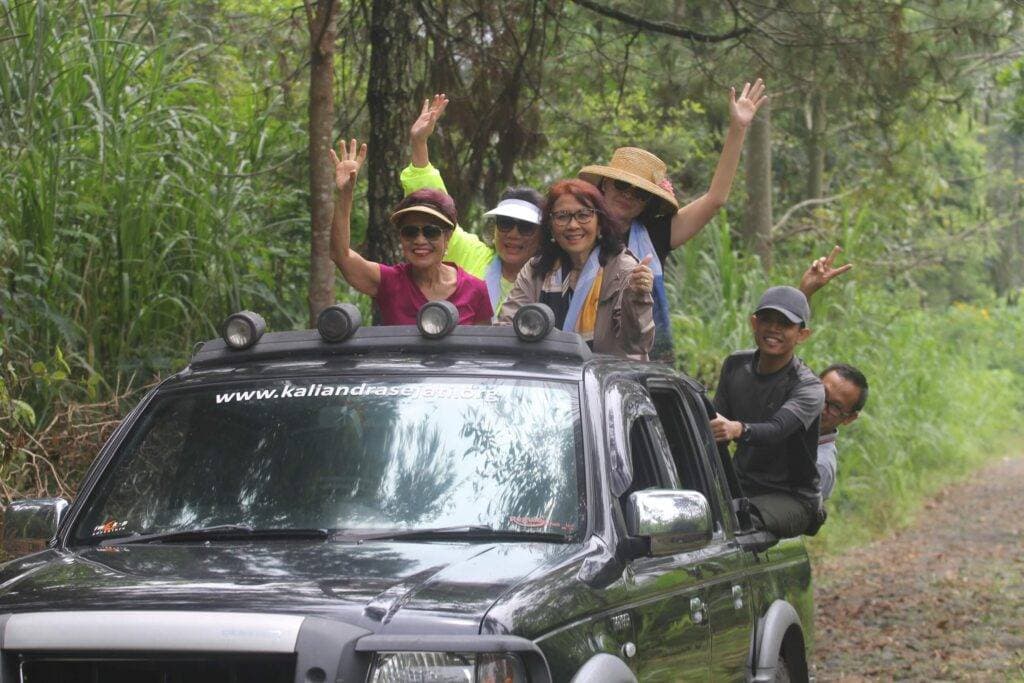 Kaliandra resort organic farm jeep off road closeup people